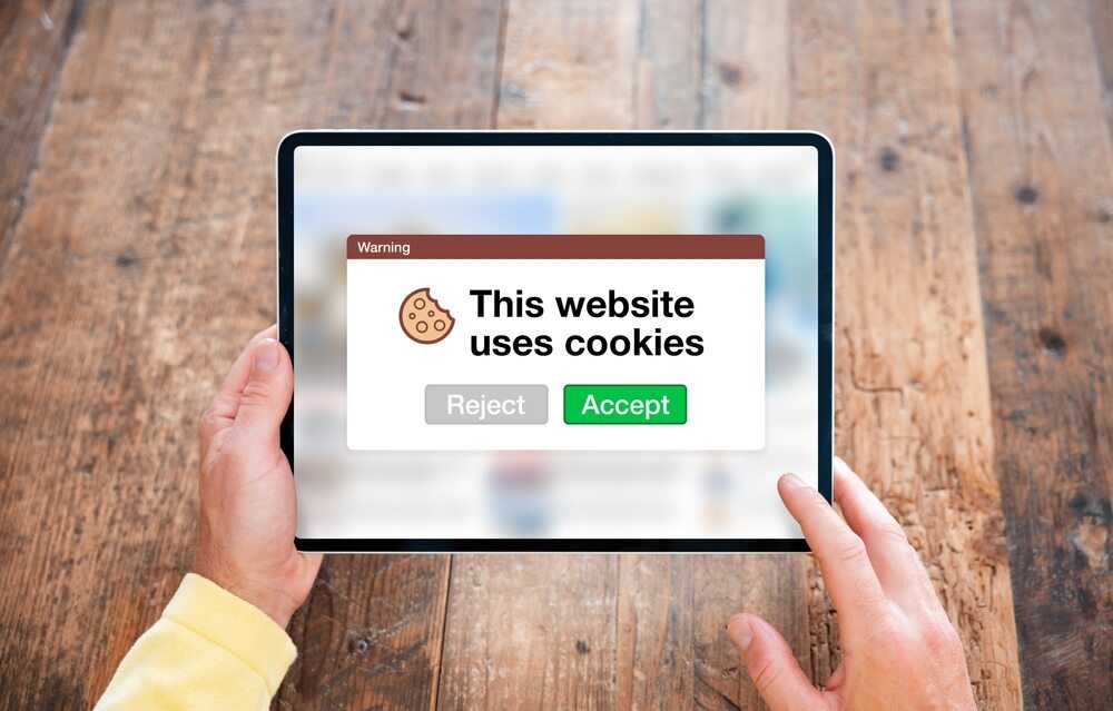 A user looking at a browser screen indicating website cookie usage